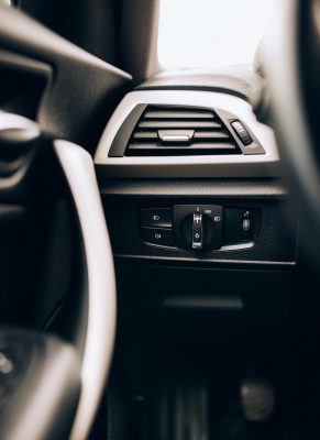 CLose up interior of modern car, details of light switch and ventilation holes